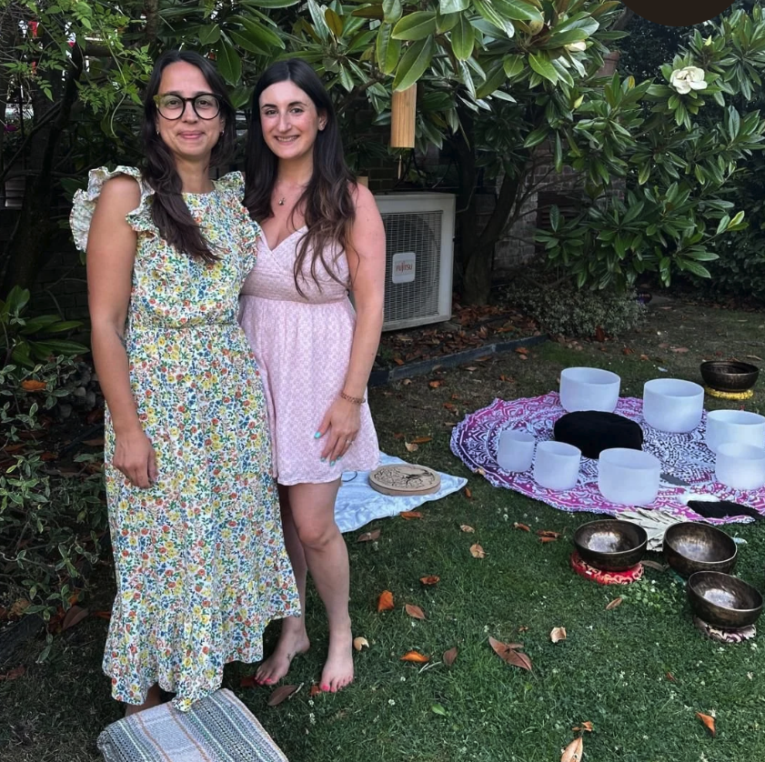 Charlotte Simmons and Charlotte B beside the singing bowls