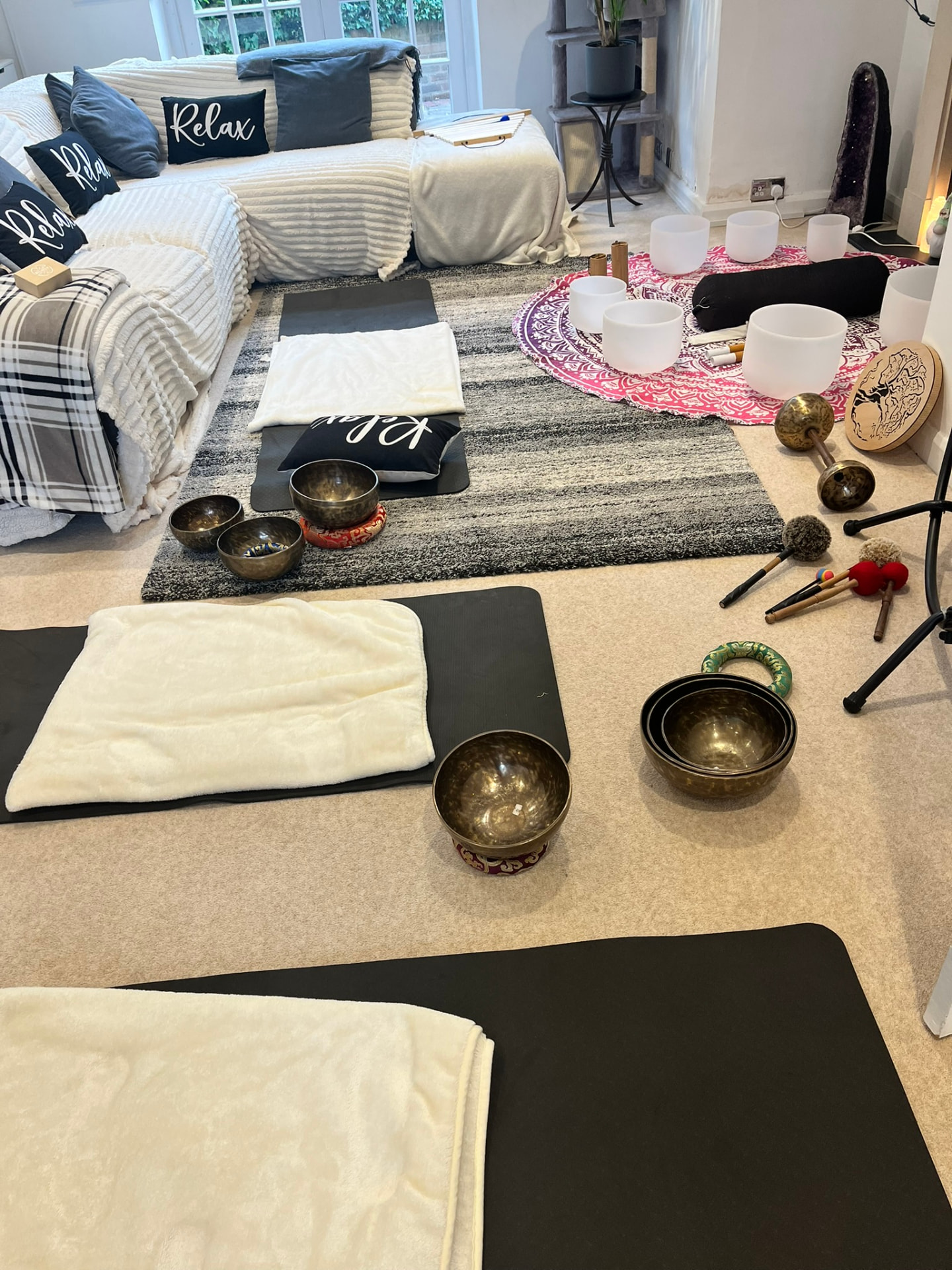 The Flow Sessions room prepared with mats, blankets and singing bowls
