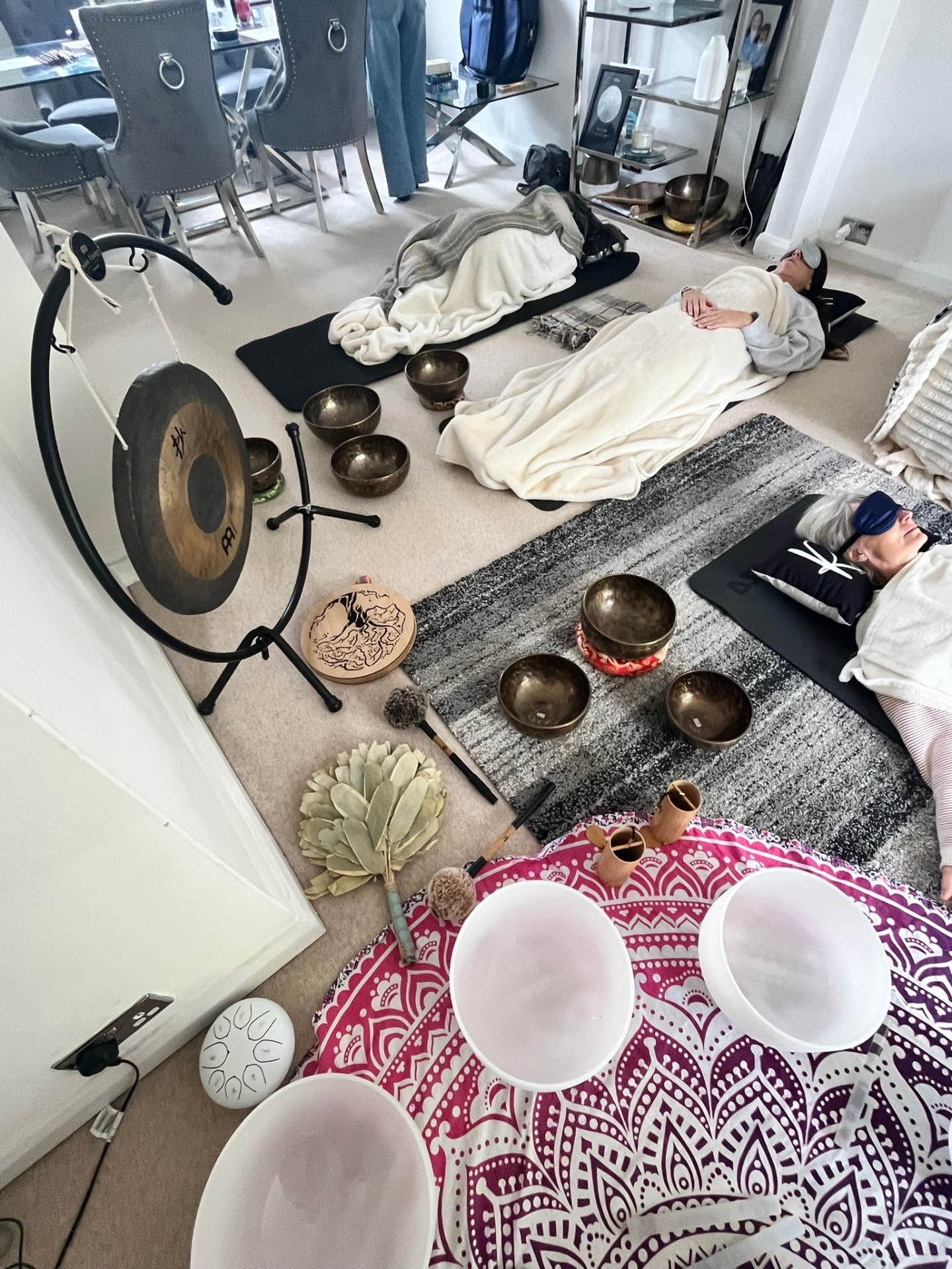 Guests resting under blankets during a Flow Sessions sound bath